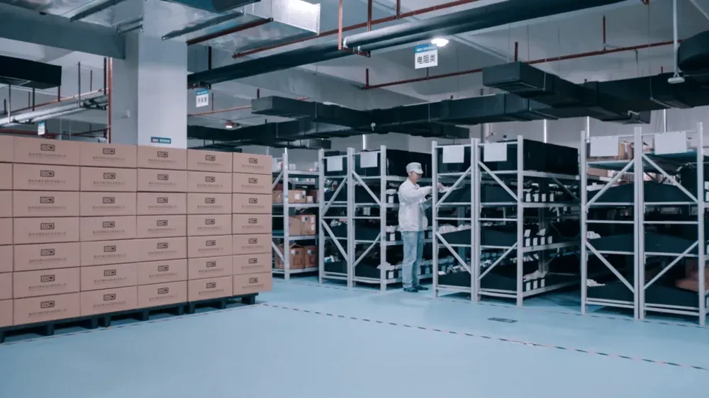 BSJ warehouse: palletised cartons on the left, part racking on the right.